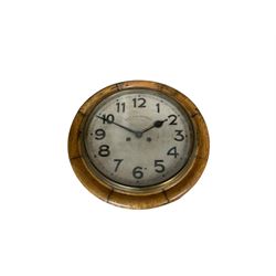 Early 20th century German spring driven striking wall clock with a 12” painted dial and spun bezel.