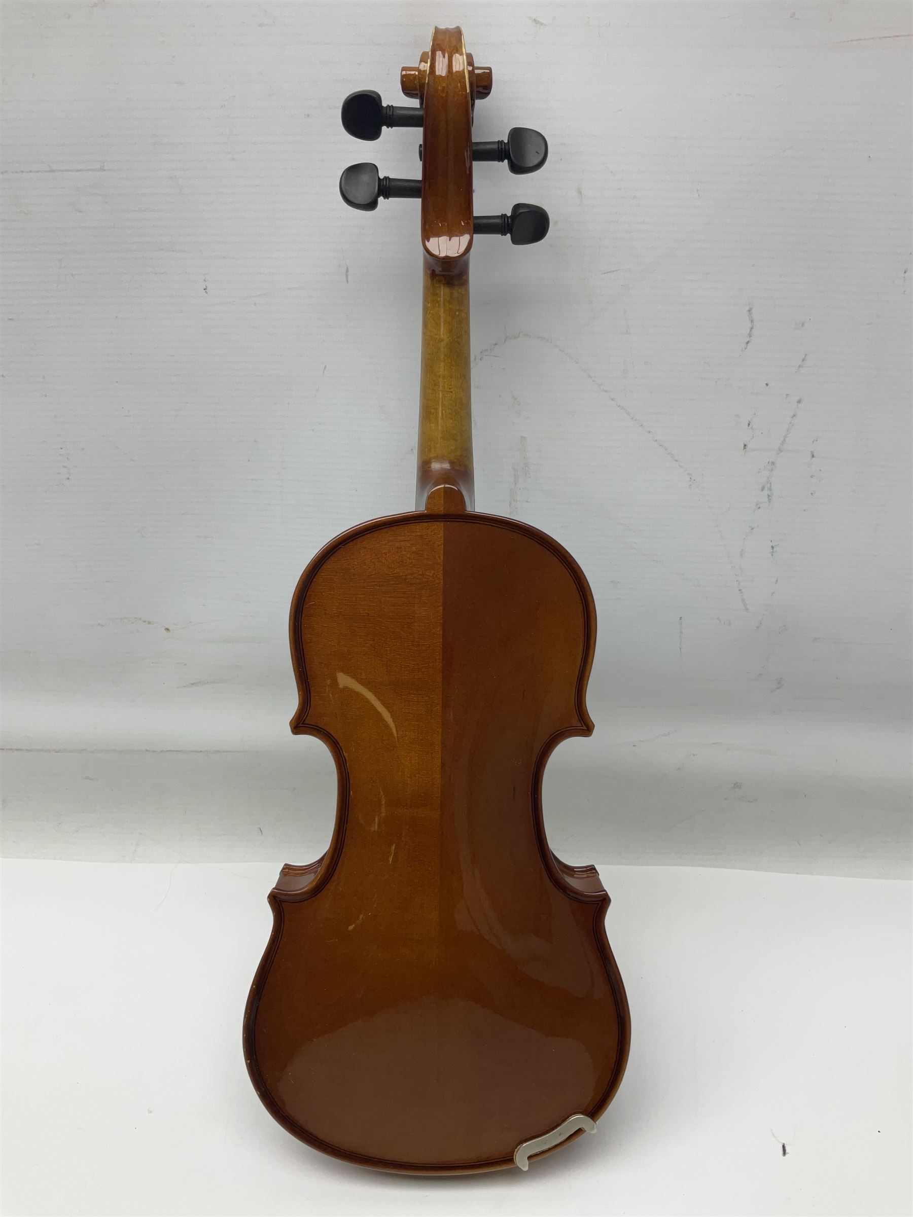 Three Stentor Student violins - three-quarter size with 33cm two-piece back; and two quarter size each with 28cm two-piece back; each in carrying case with bow (3)