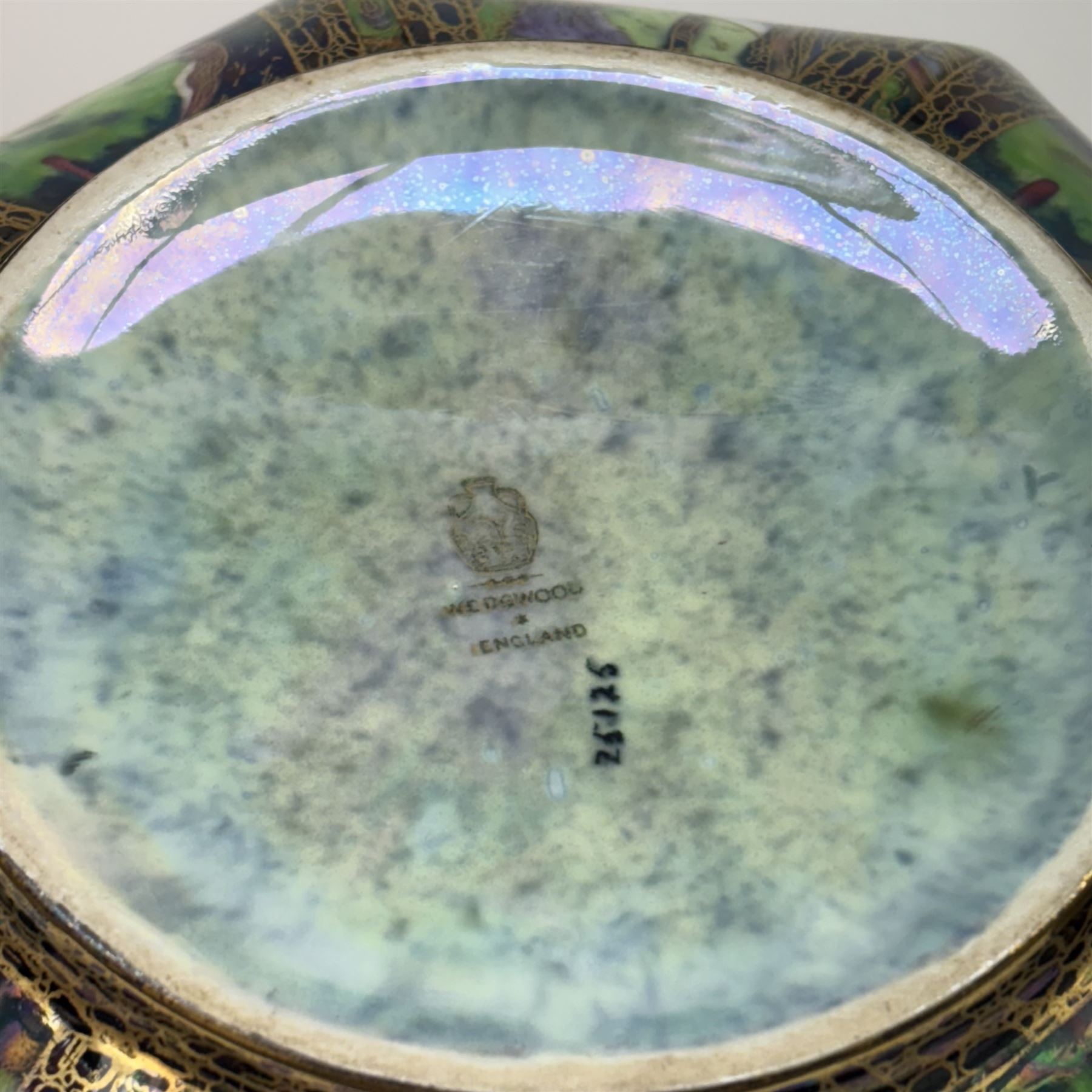 Early 20th century Wedgwood Fairland lustre bowl, circa 1920, of octagonal form, designed by Daisy Makeig-Jones, the exterior decorated in the Castle on the Road pattern, the interior decorated in the Fairy in a Cage pattern, pattern no Z5125, with printed marks beneath, H11cm D22.5cm
