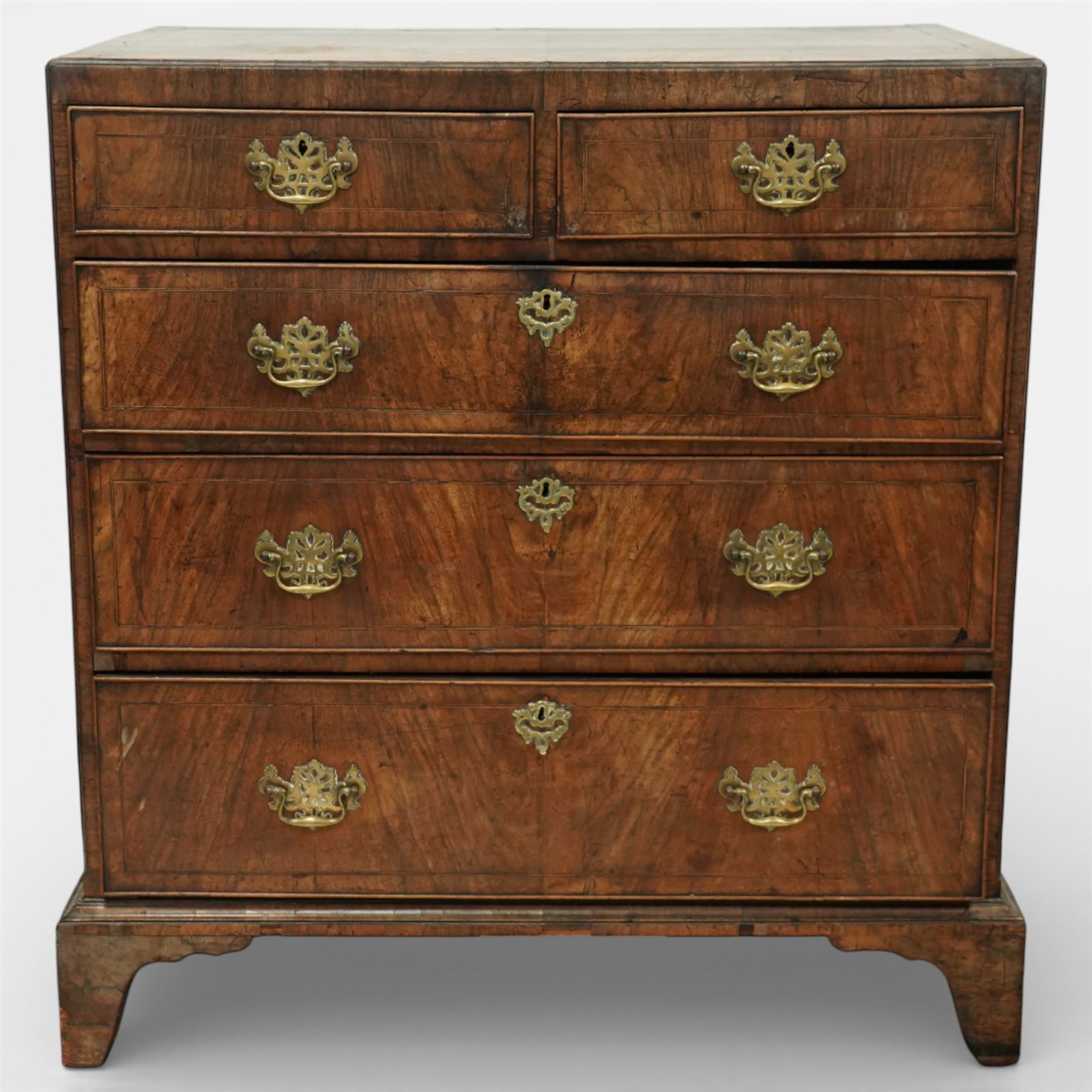 Georgian mahogany chest of drawers, the rectangular top above two short drawers over three long graduated drawers, each with brass swan neck handles and escutcheons, raised on shaped bracket feet
