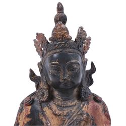 20th century bronzed buddha, with one hand raised, seated upon a lotus leaf, H27cm