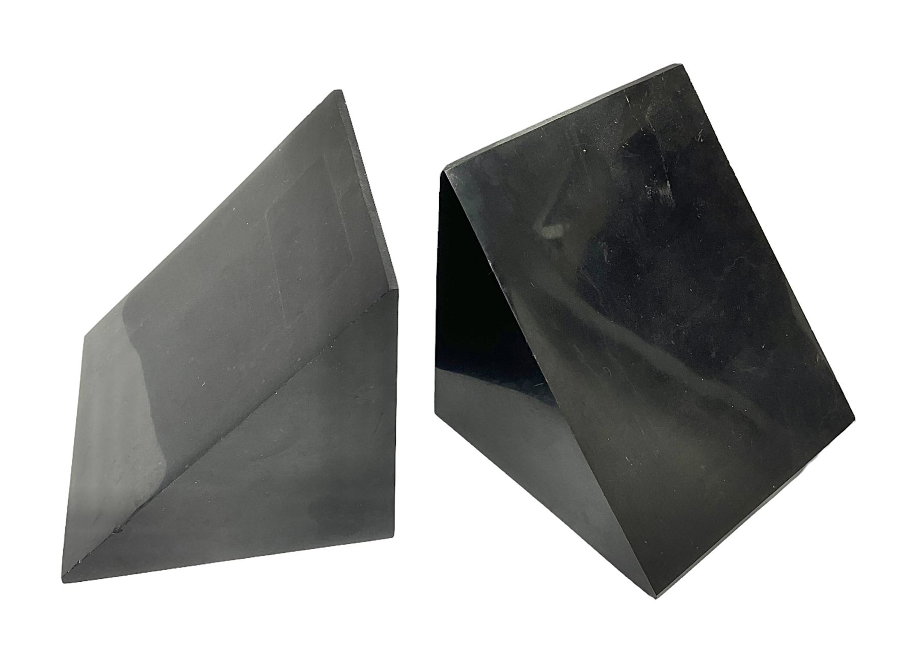 Pair of black marble book ends of triangular form, H11cm 