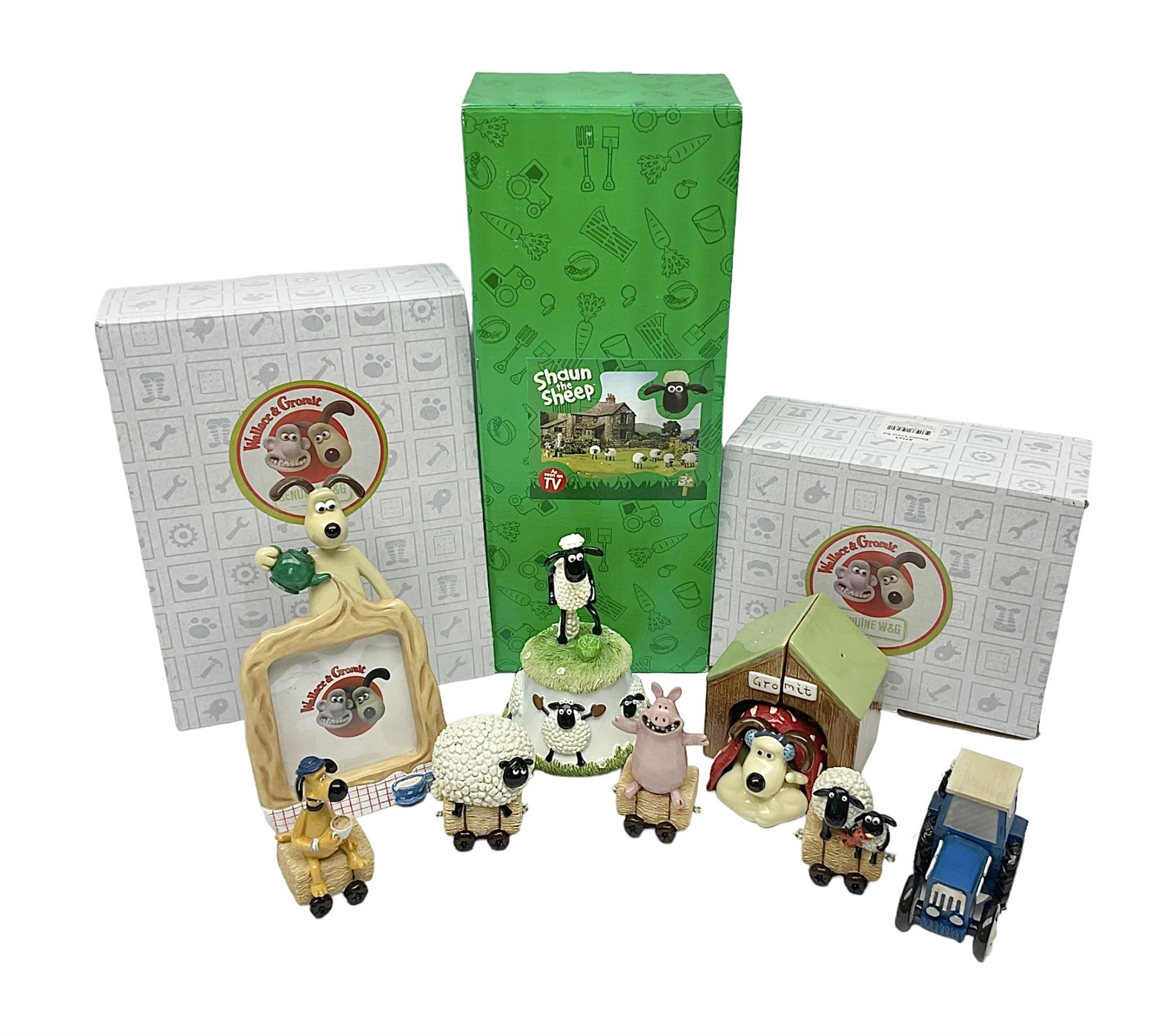 Border Fine Arts Shaun The Sheep Tractor Train and musical figure, together with a Wallace and Gromit photograph frame and a Gromit cruet sett, three in original boxes  