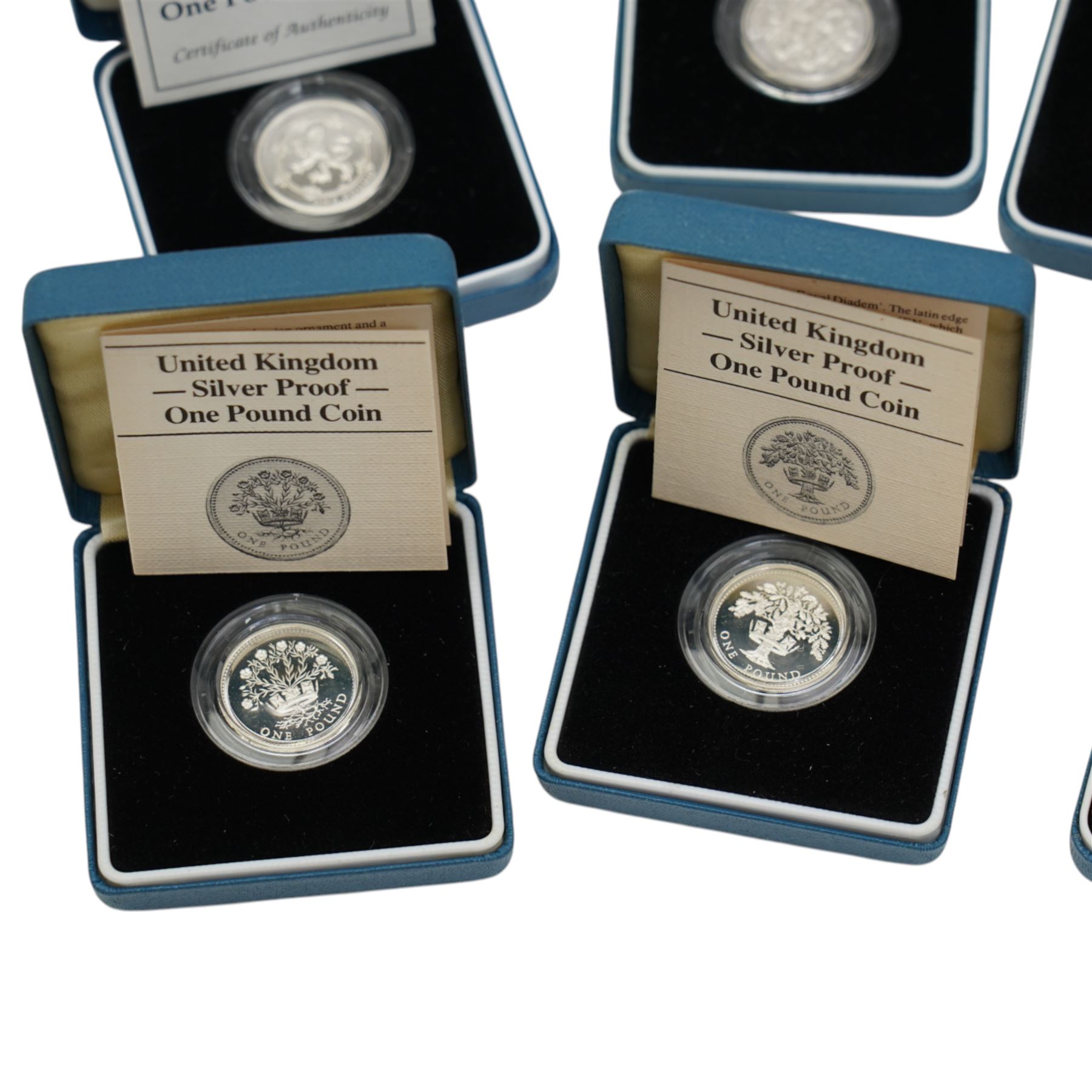 Thirteen The Royal Mint United Kingdom silver proof one pound coins, comprising 1983-1989, 1993 piedfort, 1994, 1994 piedfort, 1997, 2004, and 2006, all cased with certificates