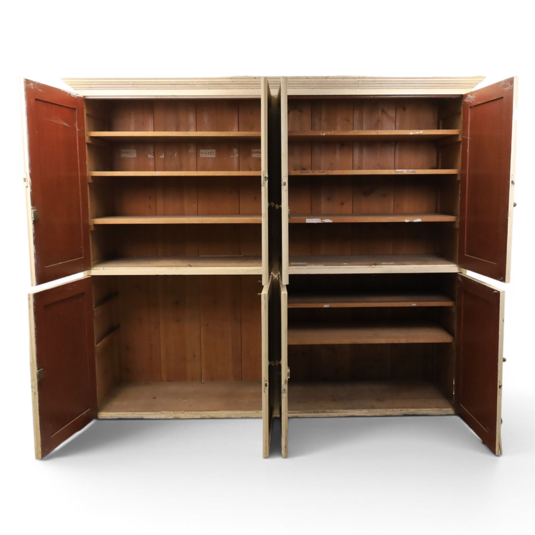 Large Georgian painted pine housekeepers cupboard, projecting cornice with four sets of twin cupboard doors with shelving enclosed