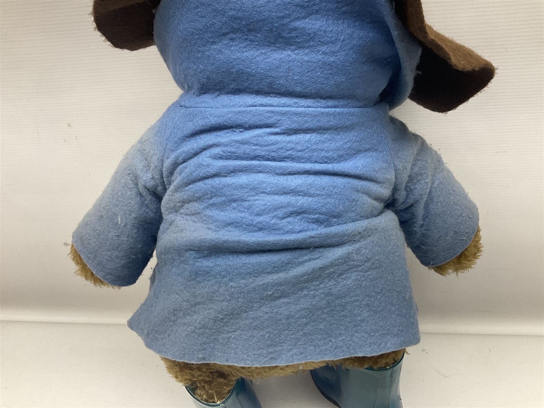 Paddington Bear with plush covered body, brown felt hat, pale blue duffle coat and blue wellingtons H54cm
