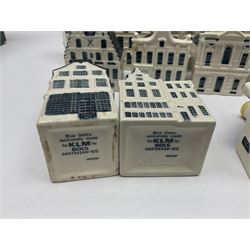 Twenty seven KLM Bols Blue Delft's decanters in the form of Dutch houses, some with contents