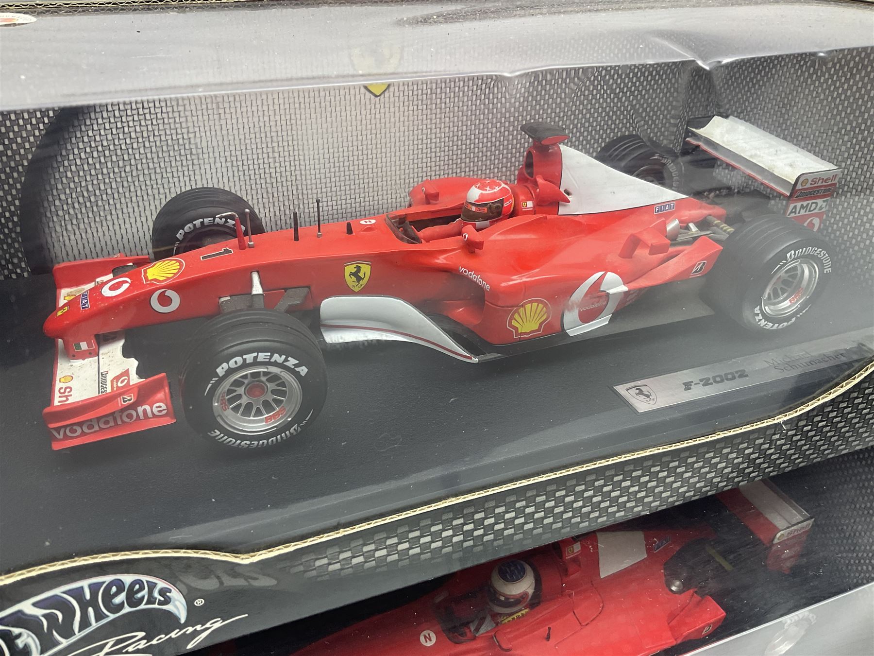 Five Mattel Hot Wheels 1:18 scale die-cast racing cars - Ferrari F1-2000 Michael Schumacher; Ferrari F-2002 Michael Schumacher; Jordan E-110 Heinz-Harald Frentzen; Williams F1 Team FW23Juan Pablo Montoya; and Ferrari F2001 Rubens Barrichello; all boxed (5)