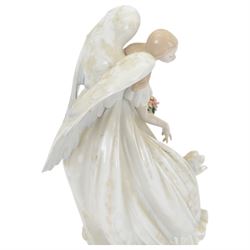 Lladro figure Flowers of Peace, modelled as an angel holding flowers, no 1867, H33cm