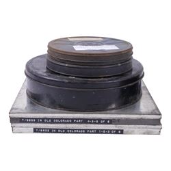 Collection of 9.5mm and 16mm cine film reels, mostly silent black and white with some notched examples, including 'Antarctic Whale Hunt' with sound, 'White Flame', 'The Good Old Days' electricity promotional, 'Rolling Around' Charlie Chaplin, etc, most in tin cases with hand written titles, together with two boxed sets of lantern slides, 'The Transvaal War', 'The Sweep & The Whitewasher' and 'Willies Revenge'