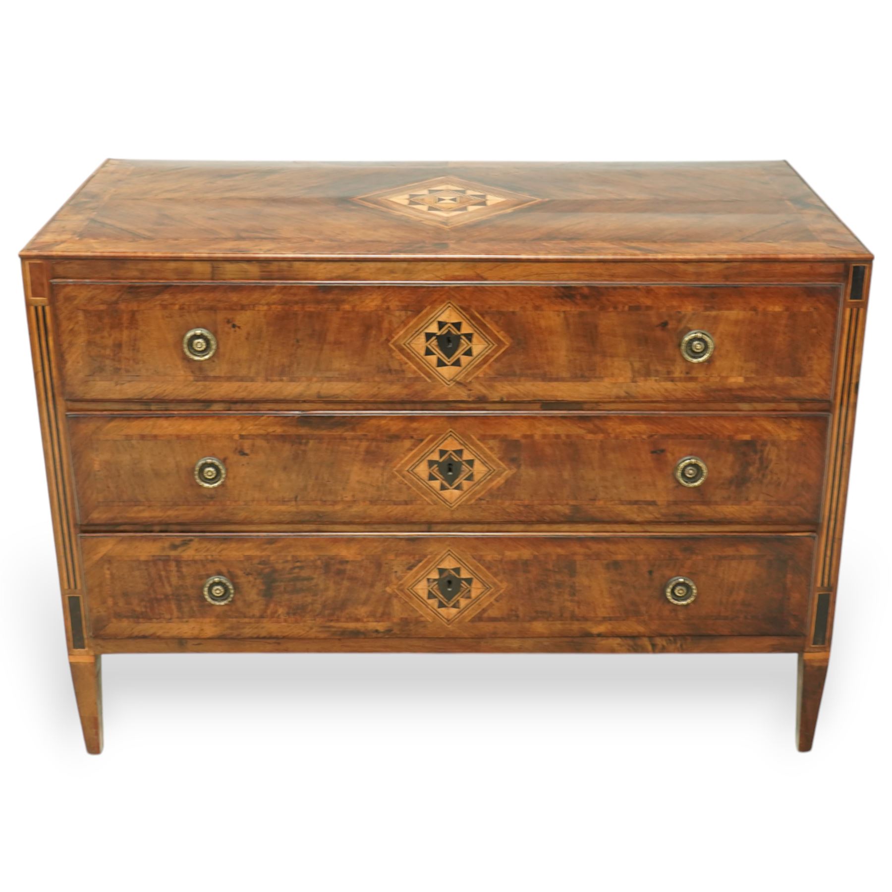 Large 18th-century North Italian walnut commode, rectangular top with quartered veneer, central parquetry inlay and raised moulded edges above three drawers with brass ring handles, cross banding and further central parquetry inlay, supported on square tapered feet