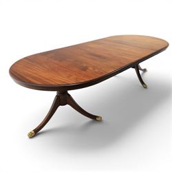 Regency design mahogany extending twin pedestal dining table with two additional leaves, r...