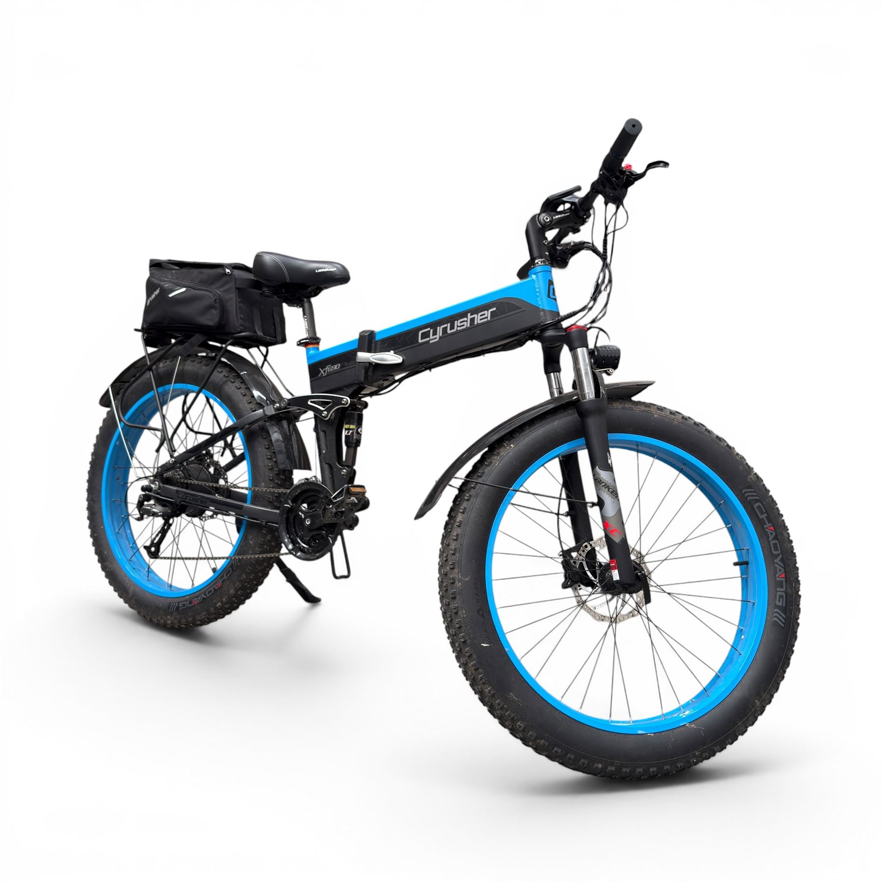 Cyrusher XF690 Plus - electric fat tyre bicycle, 250W model, with suspension forks, disc brakes, rear pannier bag and blue and black finish.