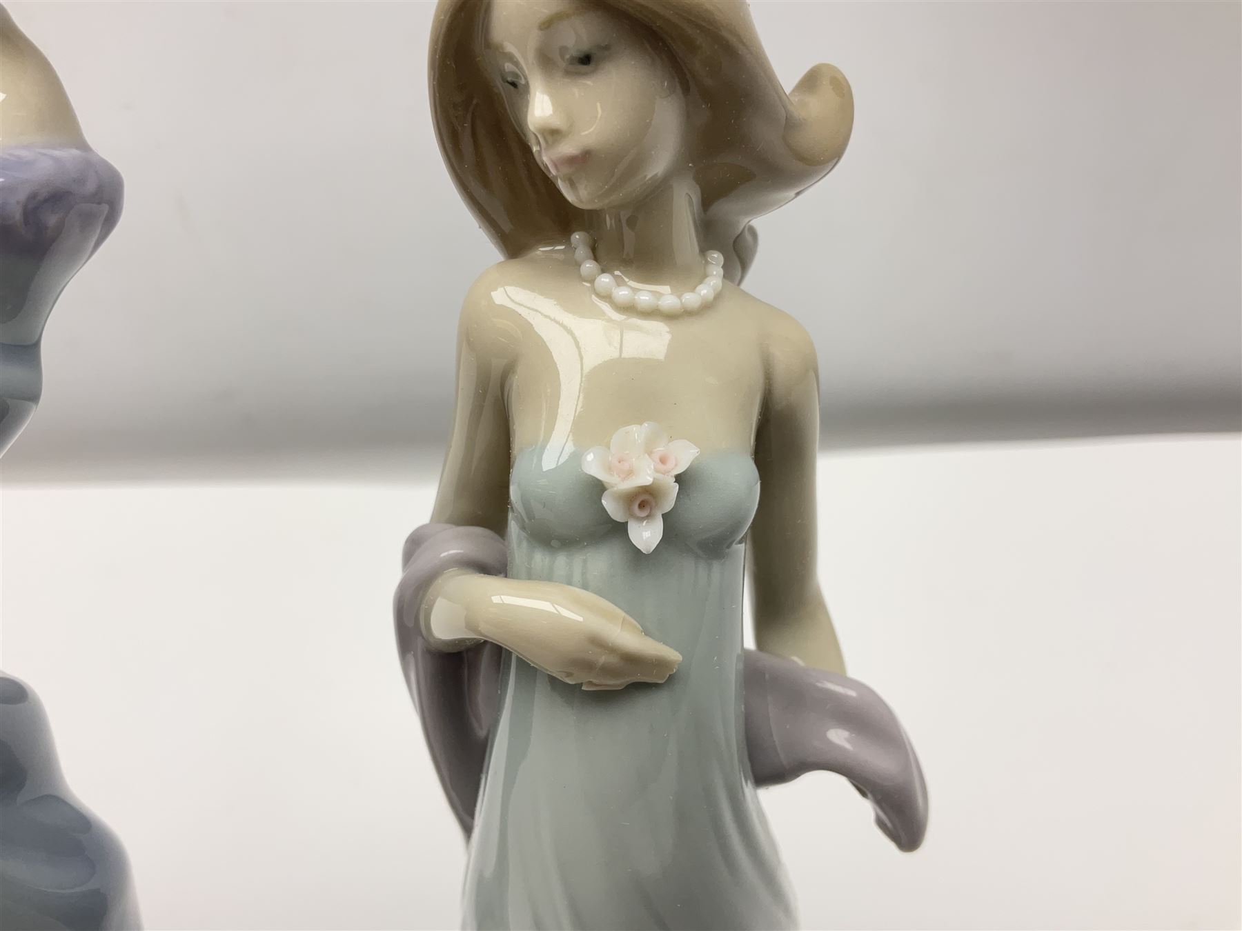 Three Lladro figures of ladies comprising 'The Flirt' model no 5789, 'Ingenue' model no 5487 and 'Carefree' model no 5790, all with boxes