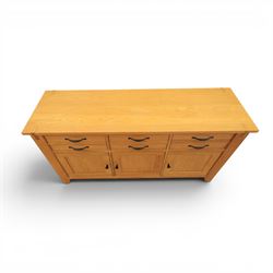 Contemporary Oak sideboard, rectangular top with tenon detailing, three drawers over three cupboard doors, blackened metal handles, raised on square supports