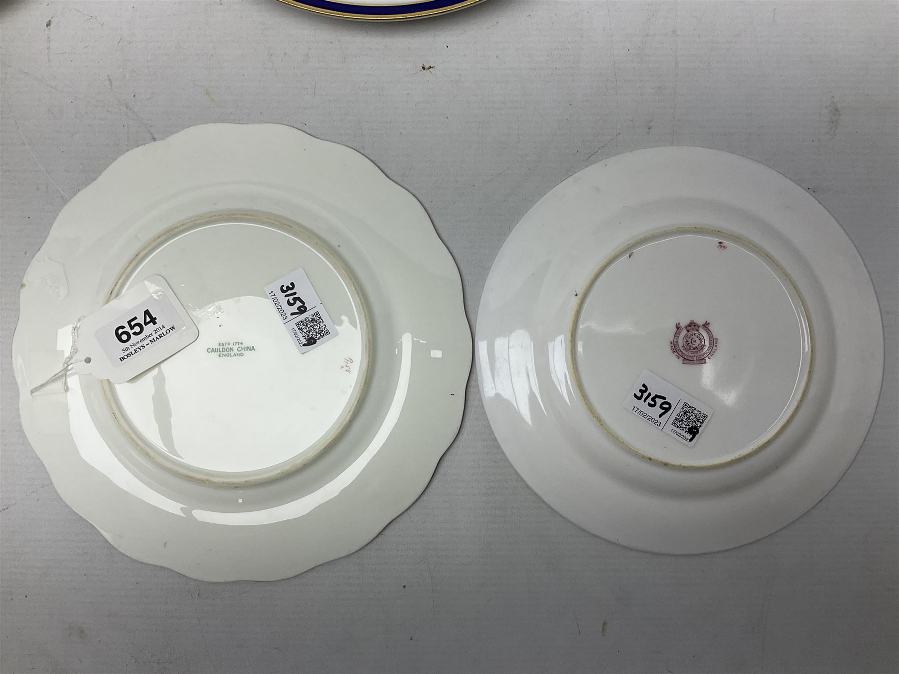 Collection of Regimental dinner wares, Comprising Royal Sussex; two dinner plates, two side plates and a soup bowl, Royal Leicestershire; two dinner plates, East Yorkshire Regiment side plate and Gordon Highlanders side plate, all decorated with the regiment's crests and blue and gilt boarders (9)