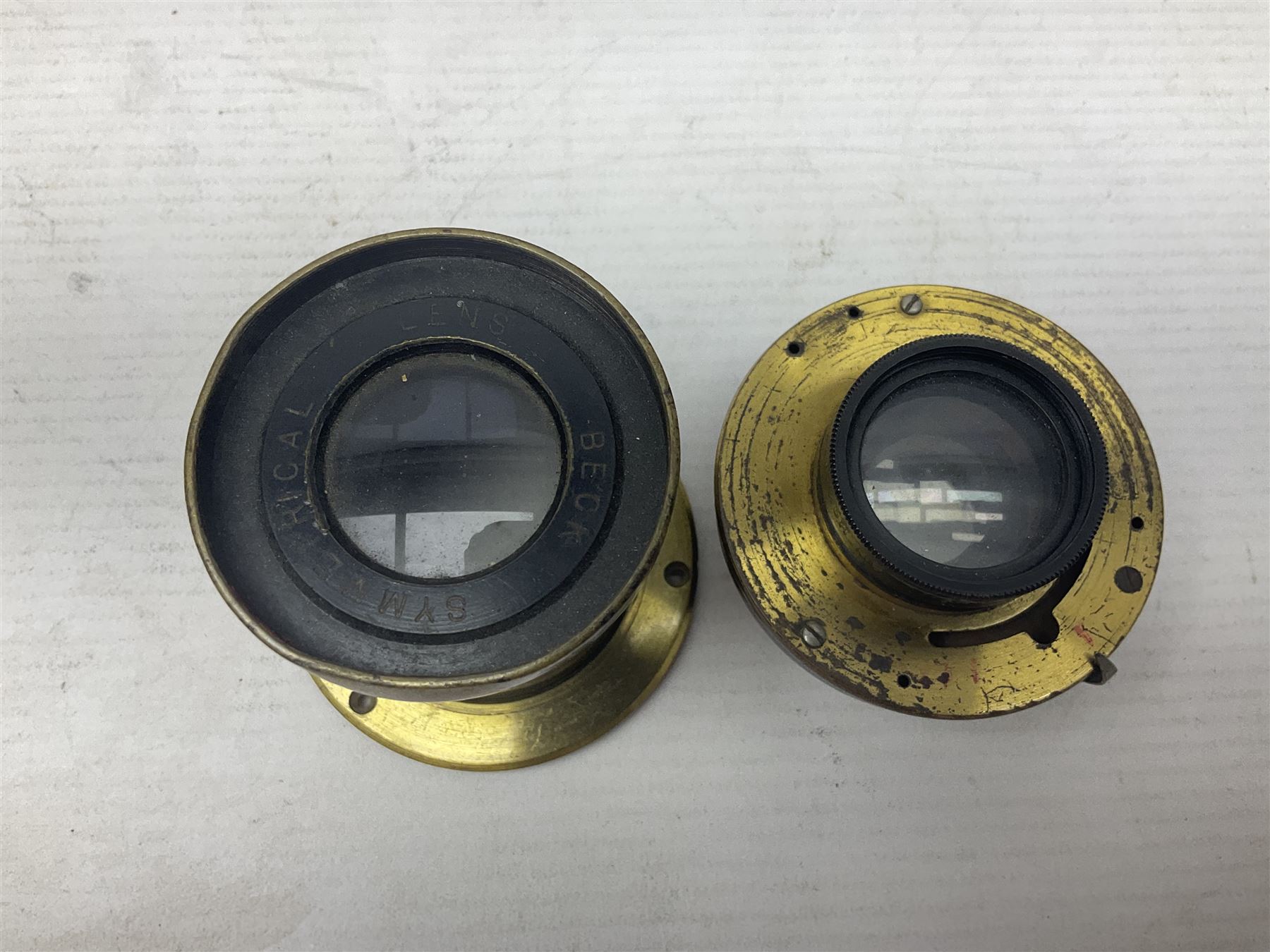 Selection of Brass Camera Lenses, to include Ross London lens 8 1/2 x 6 1/2, Beck Symmetrical lens, etc together with lens holders 