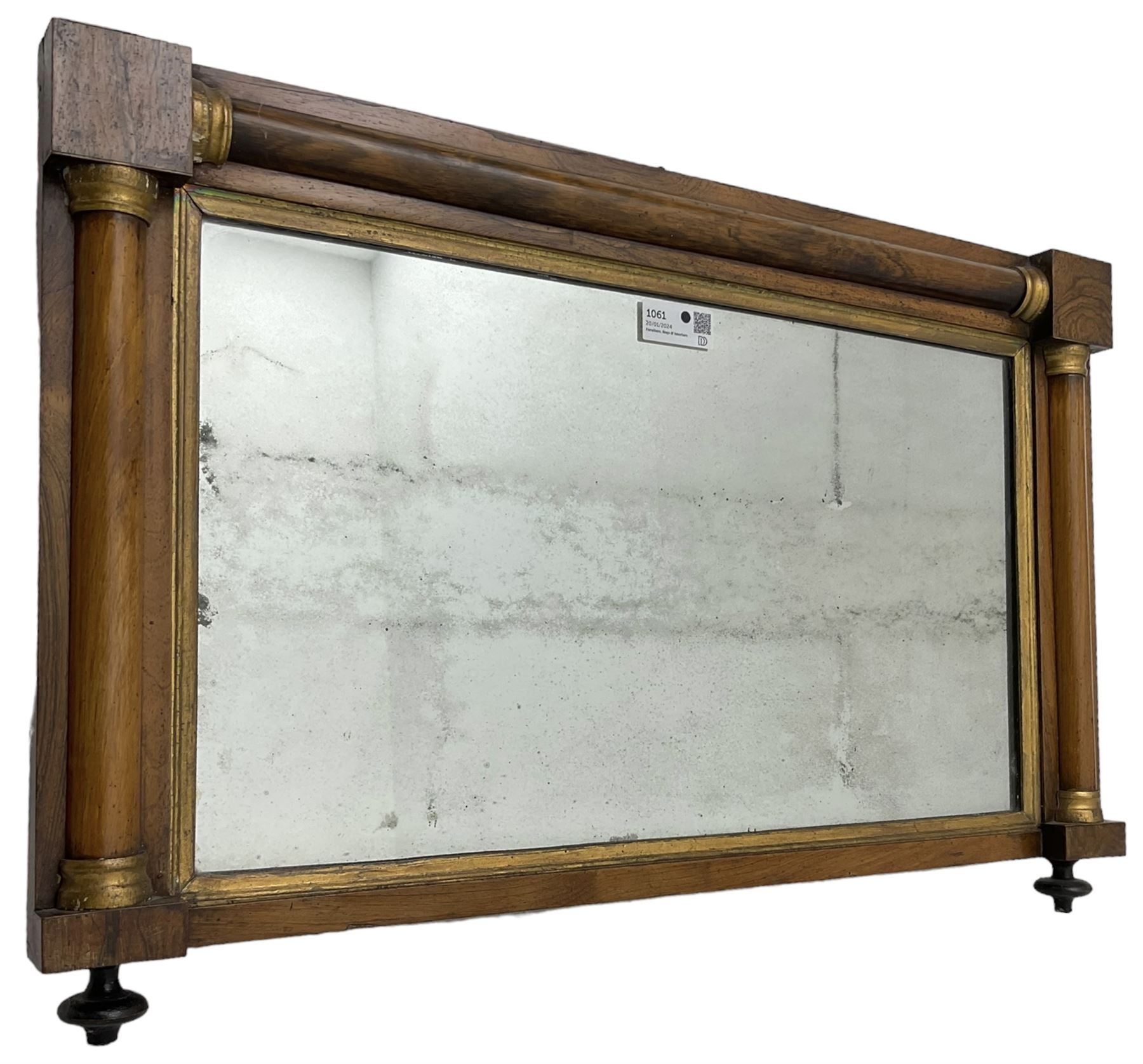 Early 19th century rosewood overmantel mirror, rectangular form with turned half pilasters, moulded gilt slip enclosing plain mirror plate, on turned feet