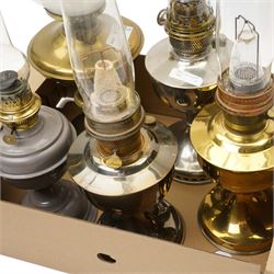 Brass table oil lamp of circular form, two Aladdin 23 lamps, Famos lamp and one other