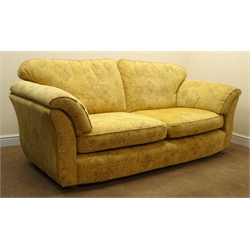  Marks and Spencer's three seat sofa upholstered in a floral patterned gold fabric, W225cm  