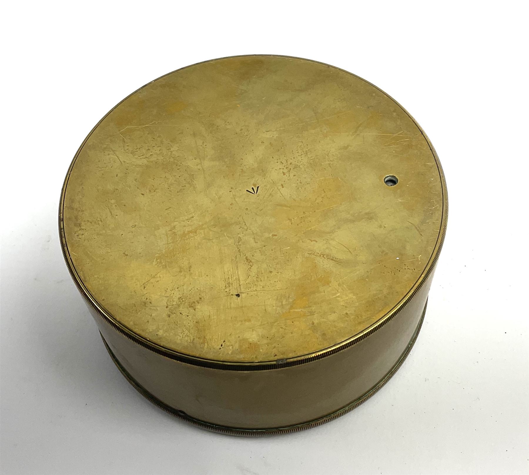 WW1 brass cased compensated barometer with altimeter scale by J. Hicks 8/9/10 Hatton Garden London No.2768, of drum shaped form, the silvered dial dated 1917, with impressed broad arrow mark to back and suspension ring to top D12cm