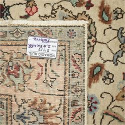 Persian Kashan rug, ivory ground field decorated with an all-over design of scrolling vines and stylized palmettes in pastel tones and conforming floral borders