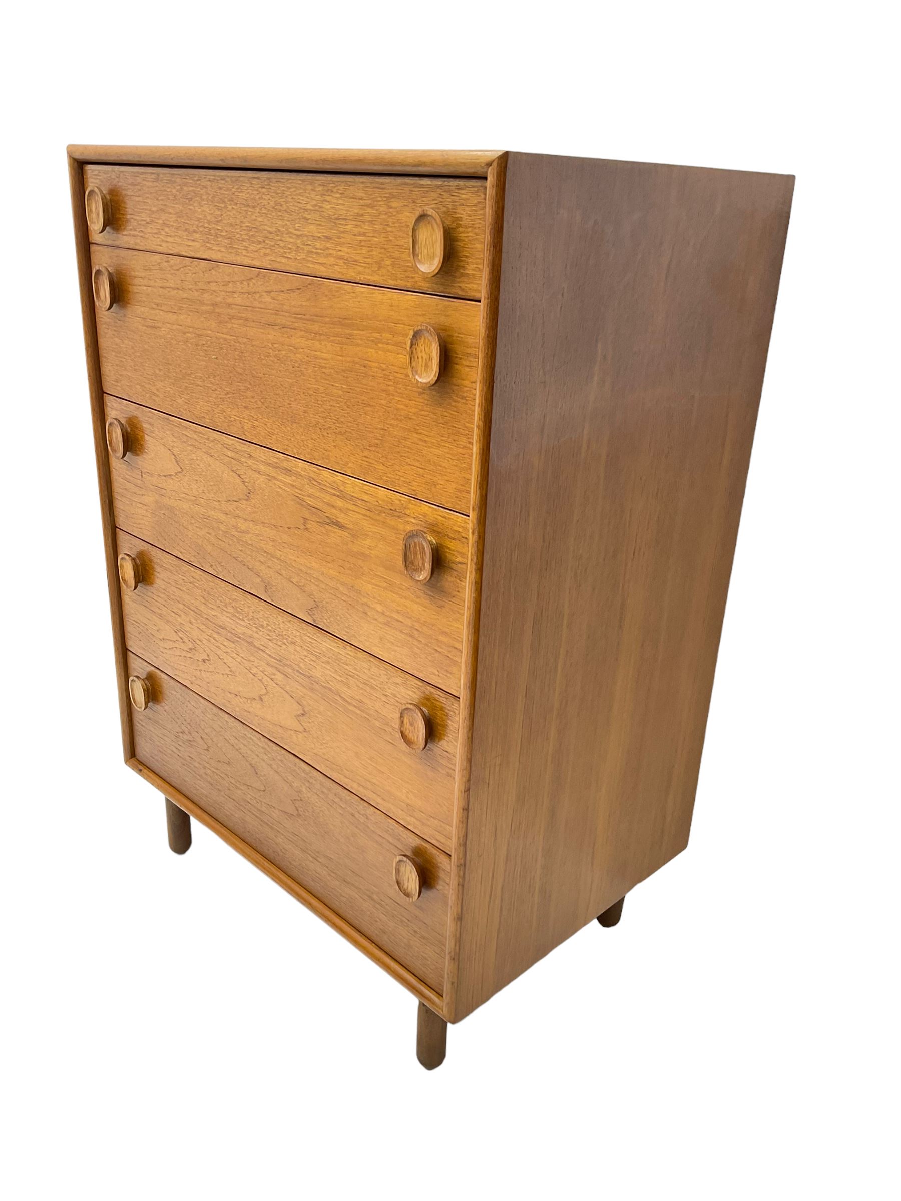 Meredew - mid-20th century teak chest of drawers, fitted with five drawers each with oval wood handles
