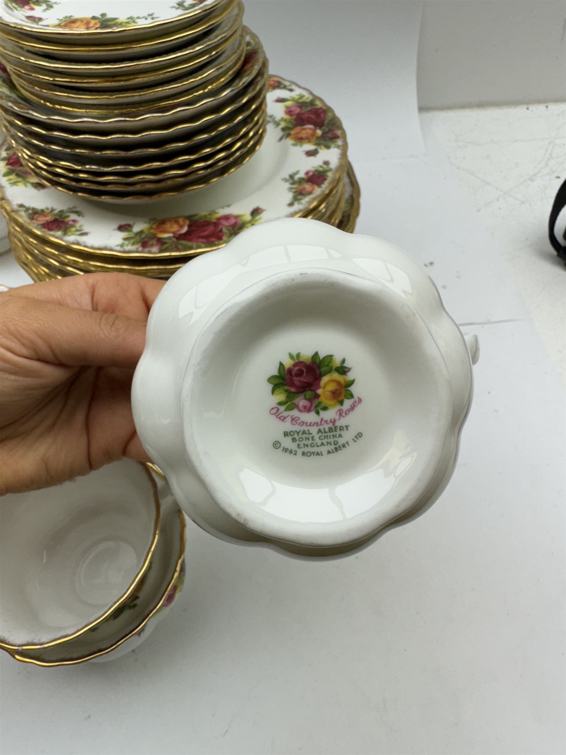 Royal Albert Old Country Roses pattern tea wares, comprising coffee pot, jug and sugar bowl, cake stands, napkin rings, teacups and saucers, side plates, dessert plates, small plates, all with printed marks beneath