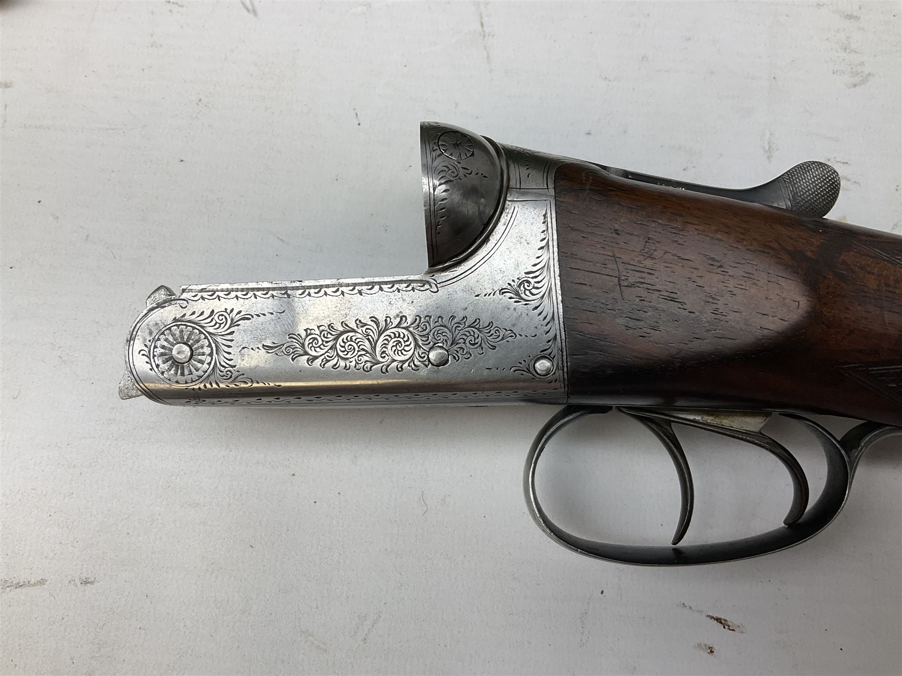 Midland Gun Company Birmingham & London 12-bore side-by-side box-lock non-ejector double barrel shotgun with 76cm damascus barrels, Prince of Wales style walnut stock with chequered grip and fore-end, top safety and engraved lock no.62160 L120cm overall; in scratch built baize lined wooden case. SHOTGUN CERTIFICATE REQUIRED.