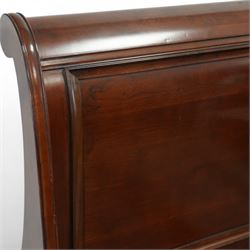 Late 20th-century mahogany Empire-style double sleigh bed, scrolled panelled headboard, and footboard, base with moulded plinth raised on bracket feet