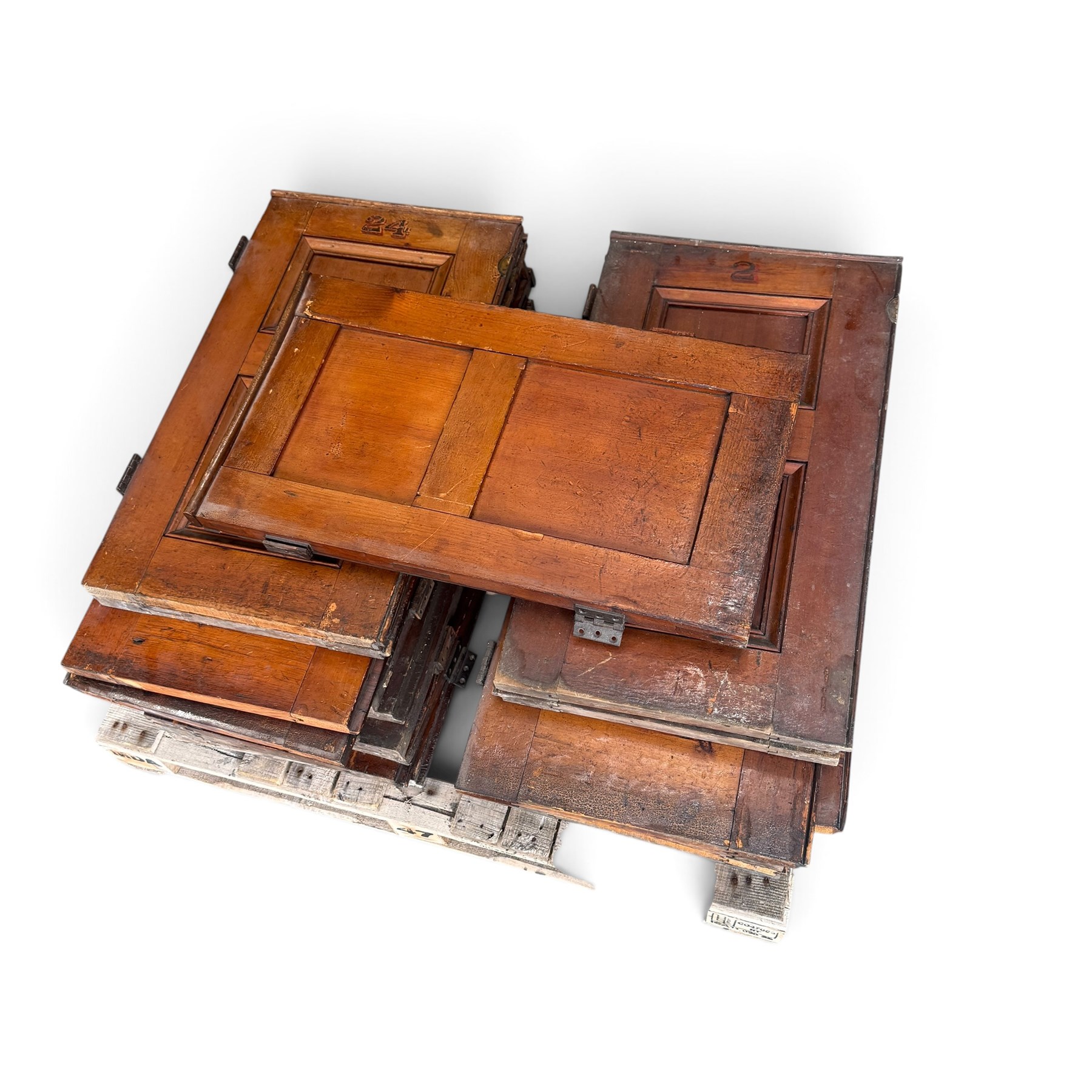 Collection of approximately twenty stained pine Victorian pew end doors or shutters, each formed of two panels with stencilled numbers to the top
Provenance: recently removed from Pocklington Methodist Church