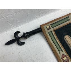 Three tapestries comprising 20th century wool tapestry panel of a medieval nobleman upon a horse with a castle in the distance, together with a smaller tapestry depicting The English Coat of Arms, both hung on rails, and further depicting village scene, largest approx 132cm x 95cm