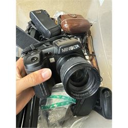 Collection of cameras and camera equipment, including Voigtlander Vitomatic I, Nikon Coolpix P340, Nikon Coolpix S9100, Olympus SP-510UZ, tripod, cases, etc