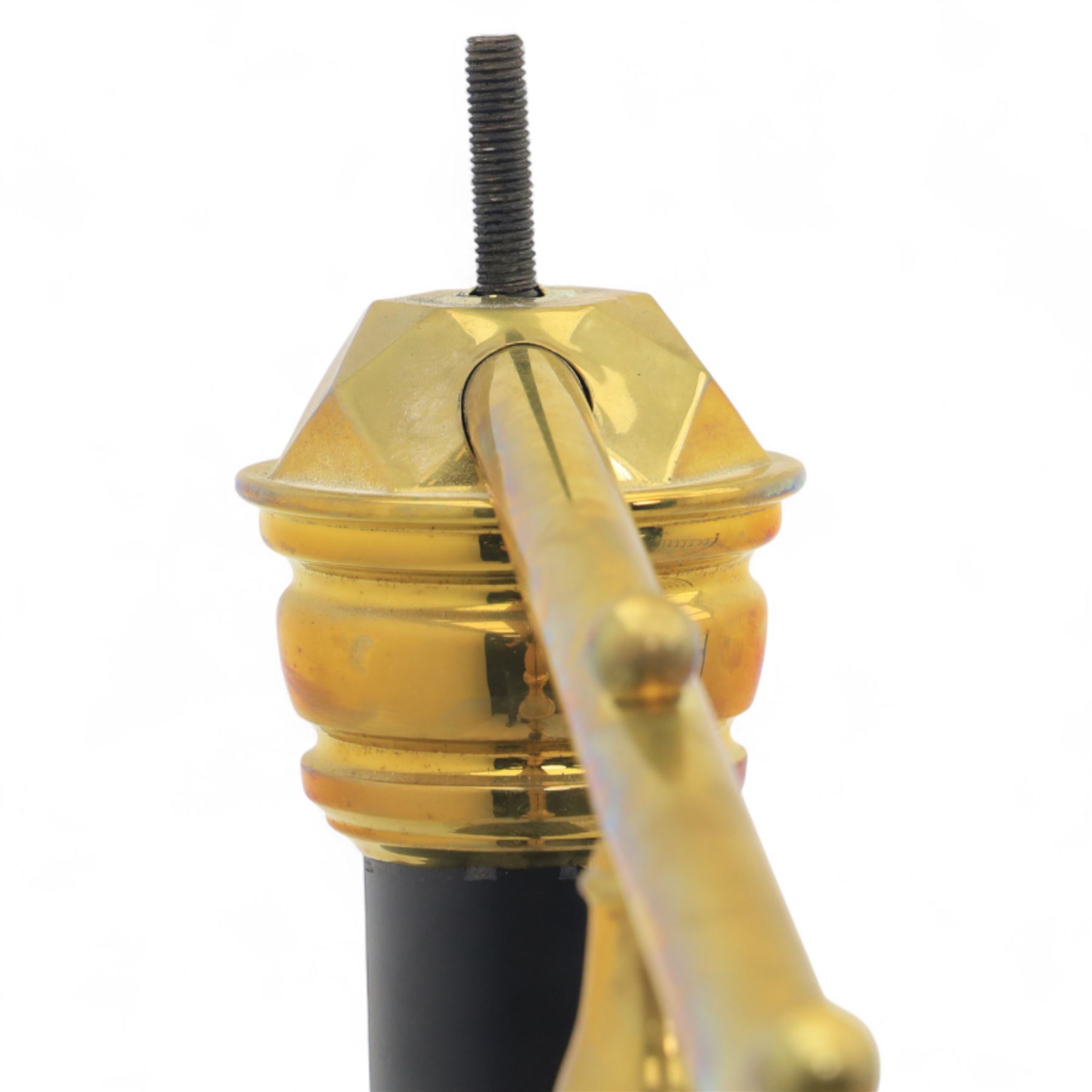 Victorian brass and iron 4' 6'' double bedstead, curved brass top rail with cast iron spindles and ornate floral rosettes flanked by urn shaped finials, foldable divan style base upholstered in a striped fabric, supported on turned posts and ceramic castors