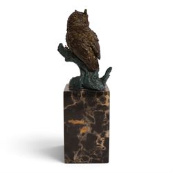 Cold painted bronze figure, modelled as an owl perched upon a tree stump signed Milo and with foundry mark, raised upon black veined marble plinth, H28cm