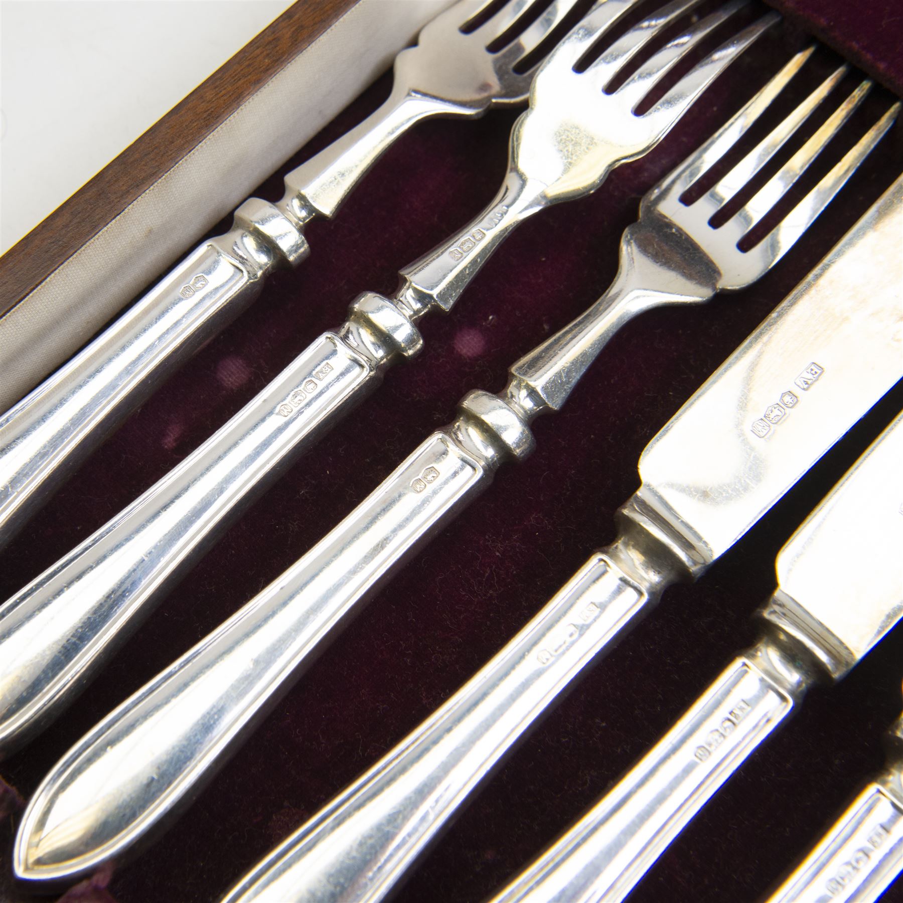 Mid 20th century silver canteen of Sandringham pattern cutlery for six place settings, comprising table spoons, table forks, silver handled table knives with stainless steel blades, dessert spoons, dessert forks, silver handled dessert knives with stainless steel blades, teaspoons, coffee spoons, silver handled fish knives and fish forks with silver blades, hallmarked Viner's Ltd, Sheffield 1955, contained in a wooden canteen with single drawer