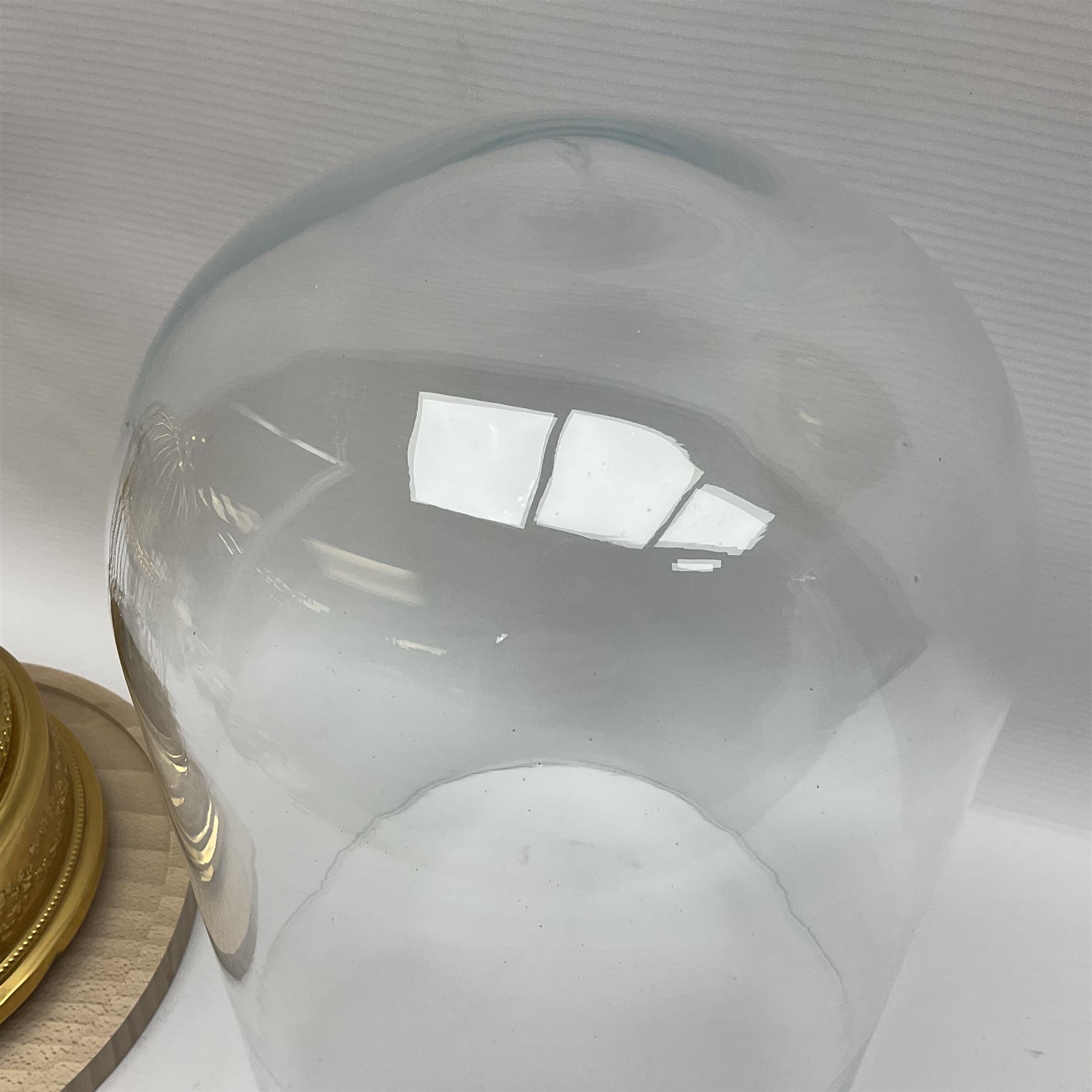 Swiss Reuge Music bird cage automaton music box, the bird with articulated head and beak, in a gilt brass cage, with a glass dome and stand, H30cm