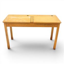 Mid-20th century beech double school desk, twin hinged desk-top compartments with inset pe...