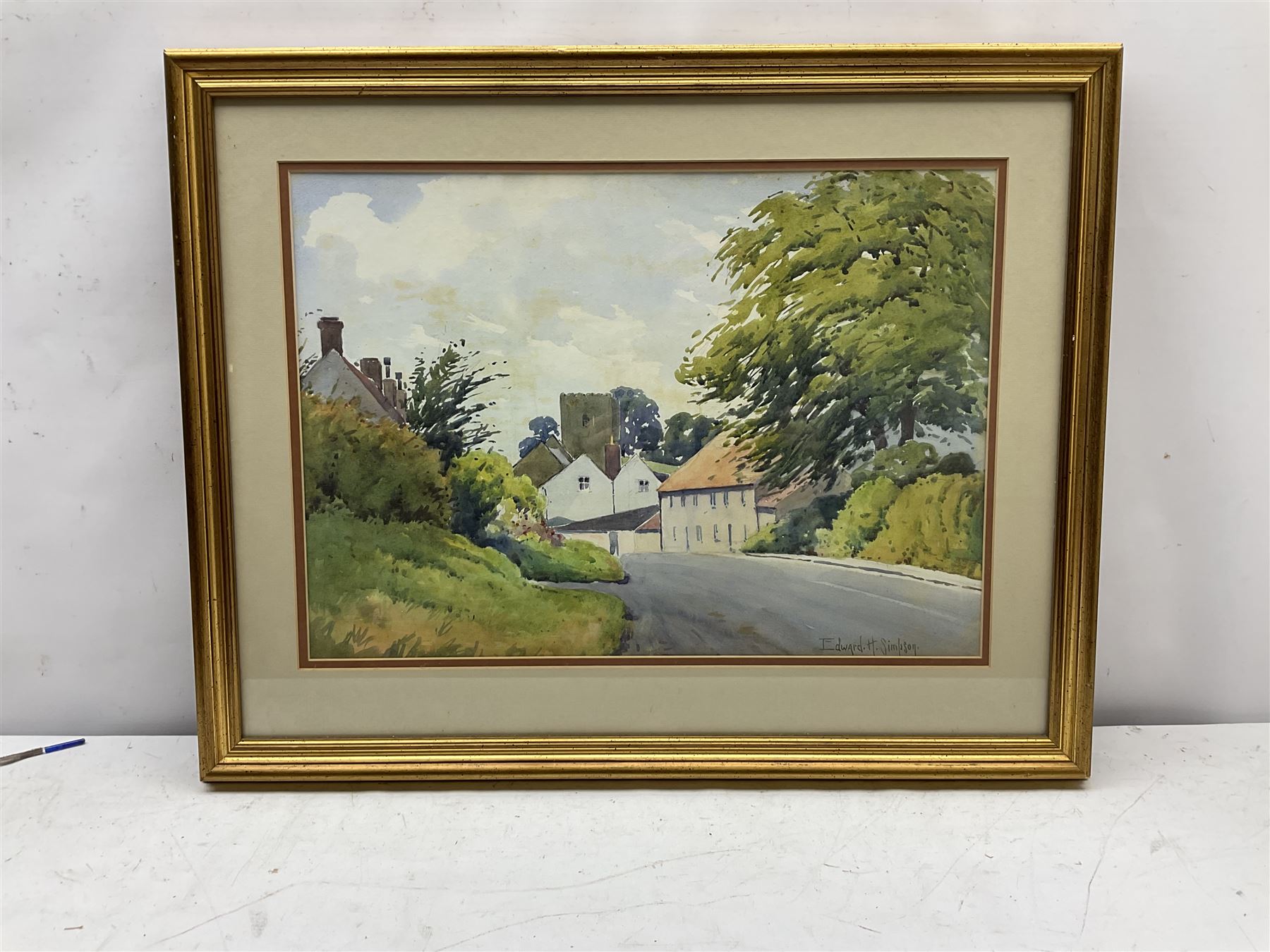 Edward H Simpson (British 1901-1989): Folkton Village Main Street and Hiking through the North Yorkshire Moors, two watercolours signed max 36cm x 52cm (2)