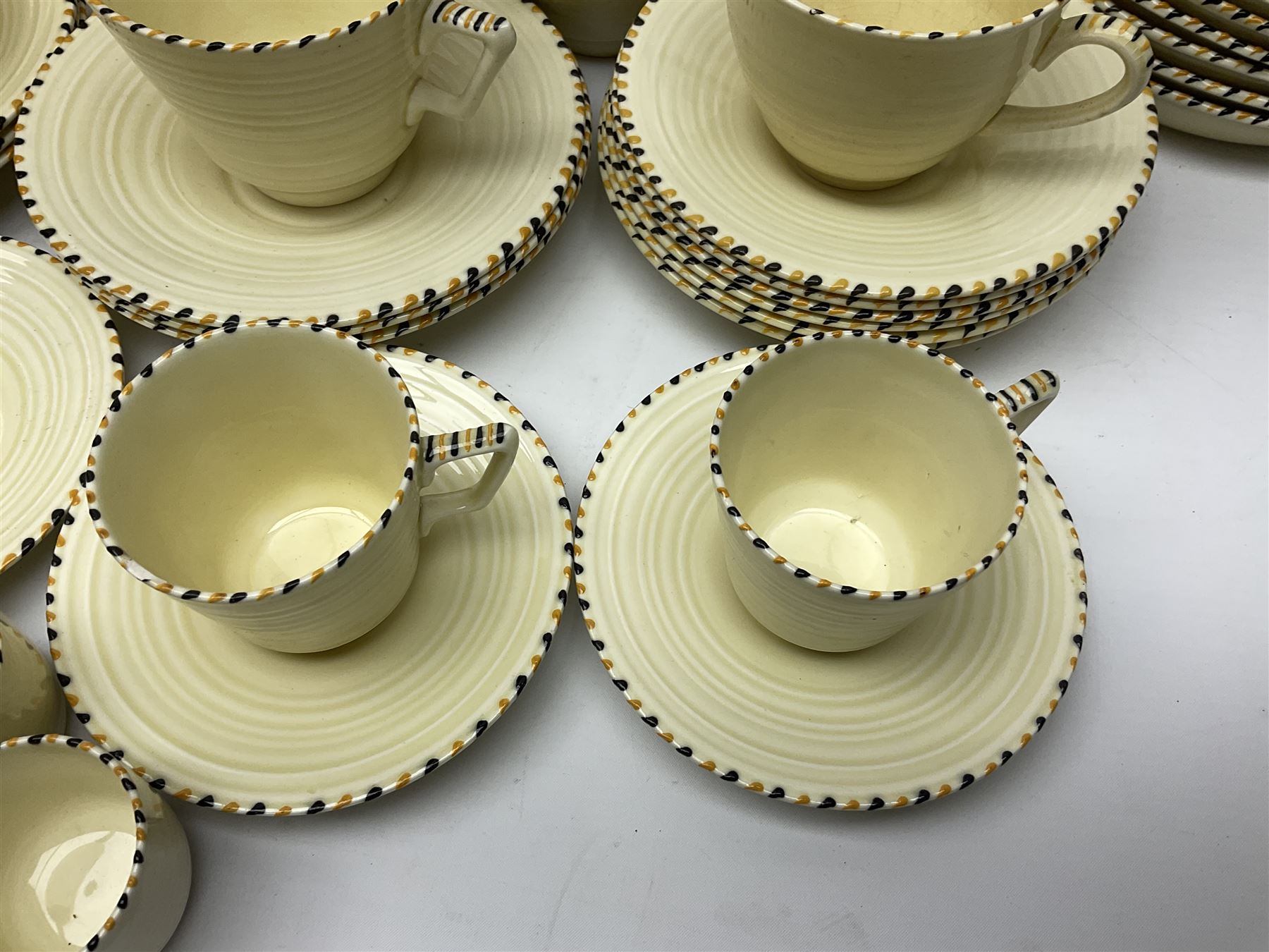 Art Deco Crown Ducal tea and dinner wares, reg no. 784158, comprising dinner plates, teacups, saucers, coffee cups, crescent shaped side plates, bowls, eggcups, etc, (93)