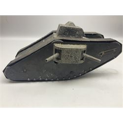 Large clockwork model of a WW1 Tank made of tin-plate and aluminium, with moving side cannons, the clockwork chain driven movement driving the articulated tin tracks; L28.5cms  W16.5cms and H13.5cms