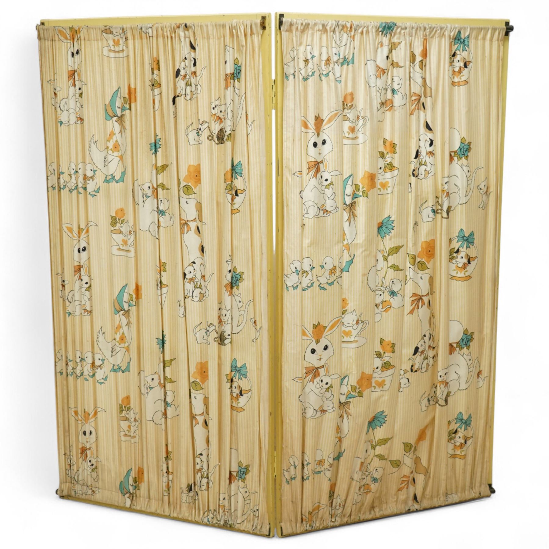 *Mid 20th century nursery set, comprising a cream painted metal cot with adjustable base, a wicker baby basket on wheeled stand, and a folding nursery screen with printed fabric panels decorated with playful animal and teddy bear motifs

Cot (H 112cm, W 136cm, D 77cm)
Screen (H 139cm, W 148cm) 
Basket (H 72cm, W 59cm, D 40cm)From the Kirkham Hall Attic & Cellar Collection, sold without reserve