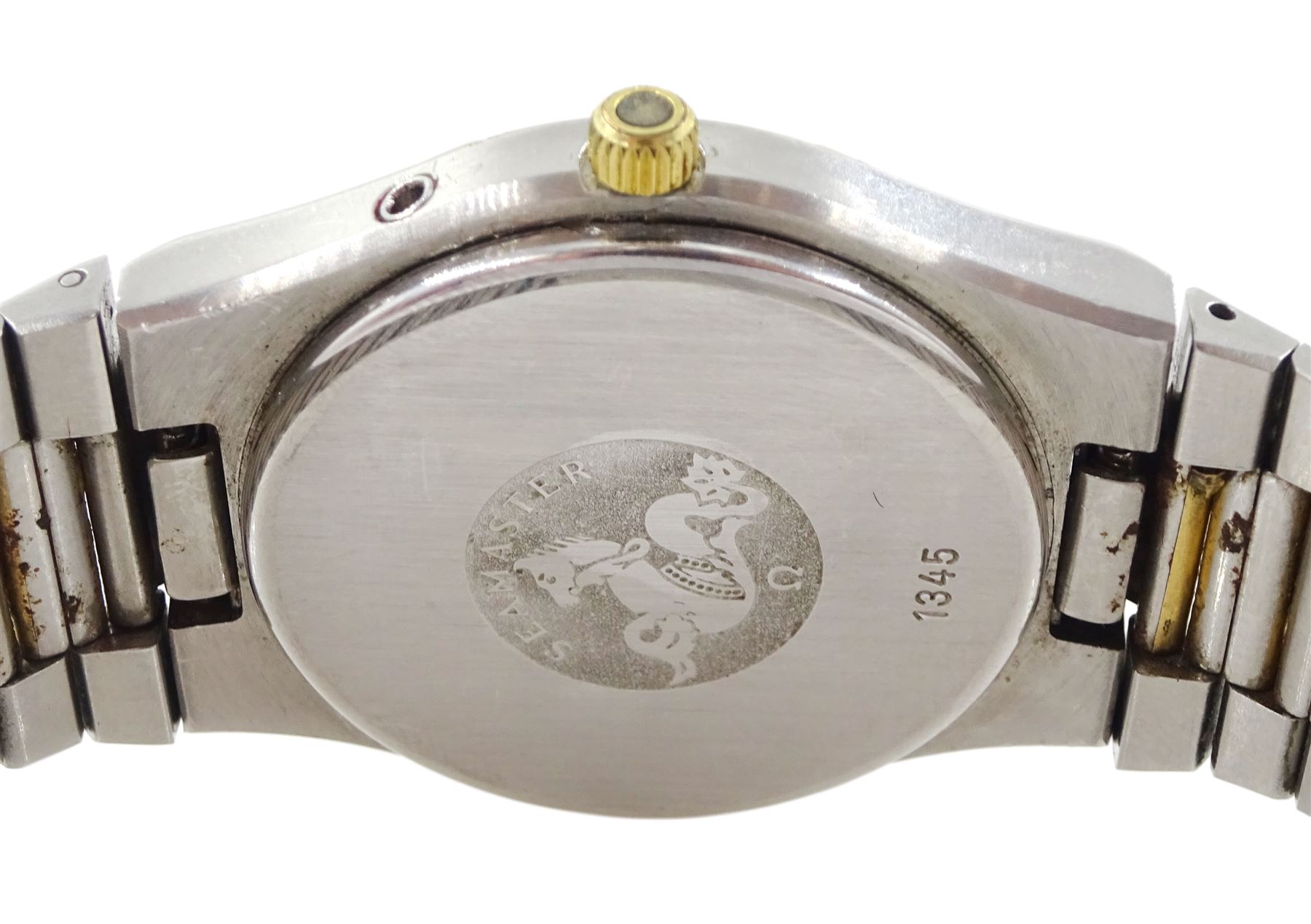 Omega Seamaster gentleman's quartz wristwatch, backcase No. 1345, champagne dial with baton hour markers and day / date aperture, boxed with papers