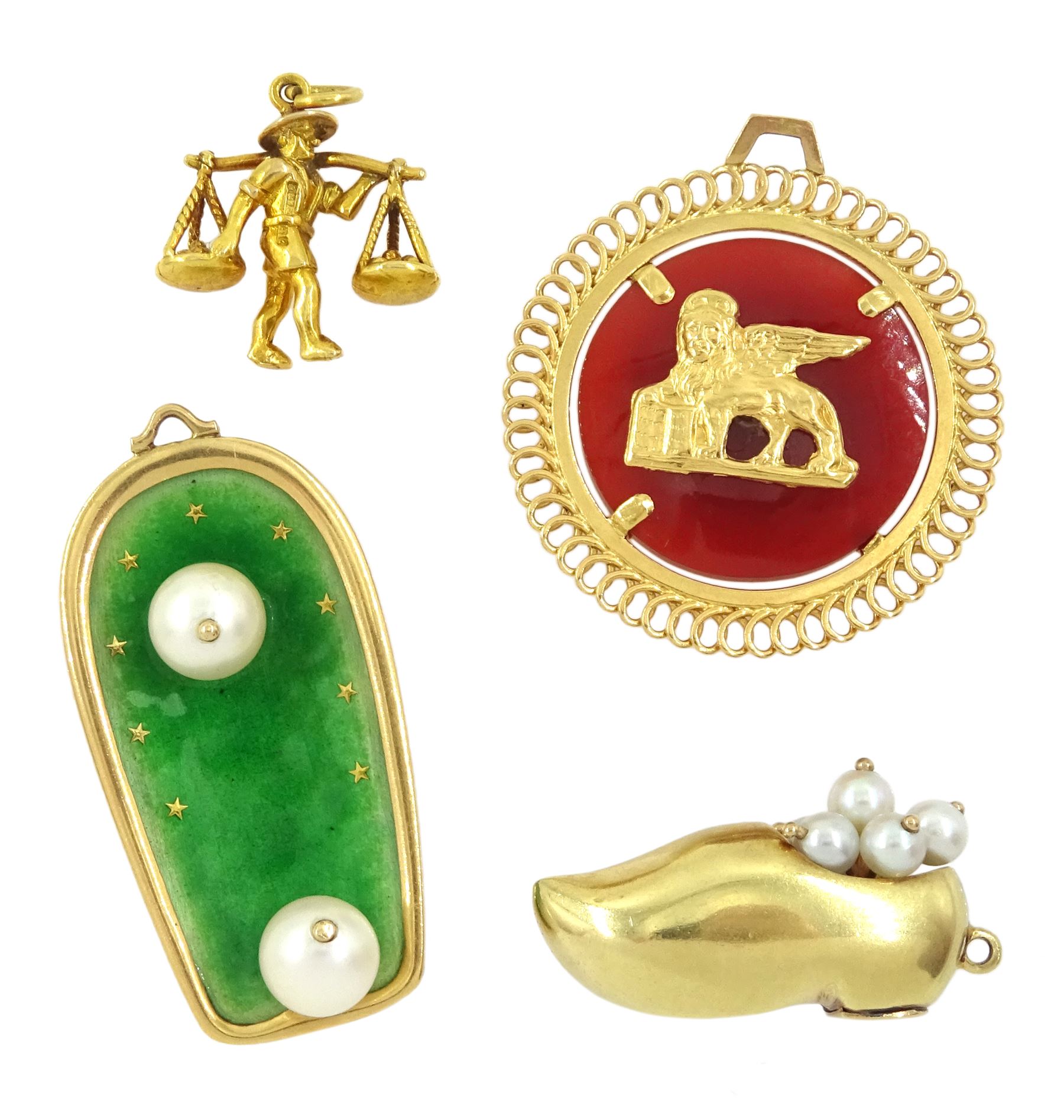 Four gold pendant / charms including 18ct gold hardstone set Winged Lion St Mark Venice, 9ct gold market seller, 14ct gold pearl clog shoe and an 18ct gold cultured pearl and green enamel surf board