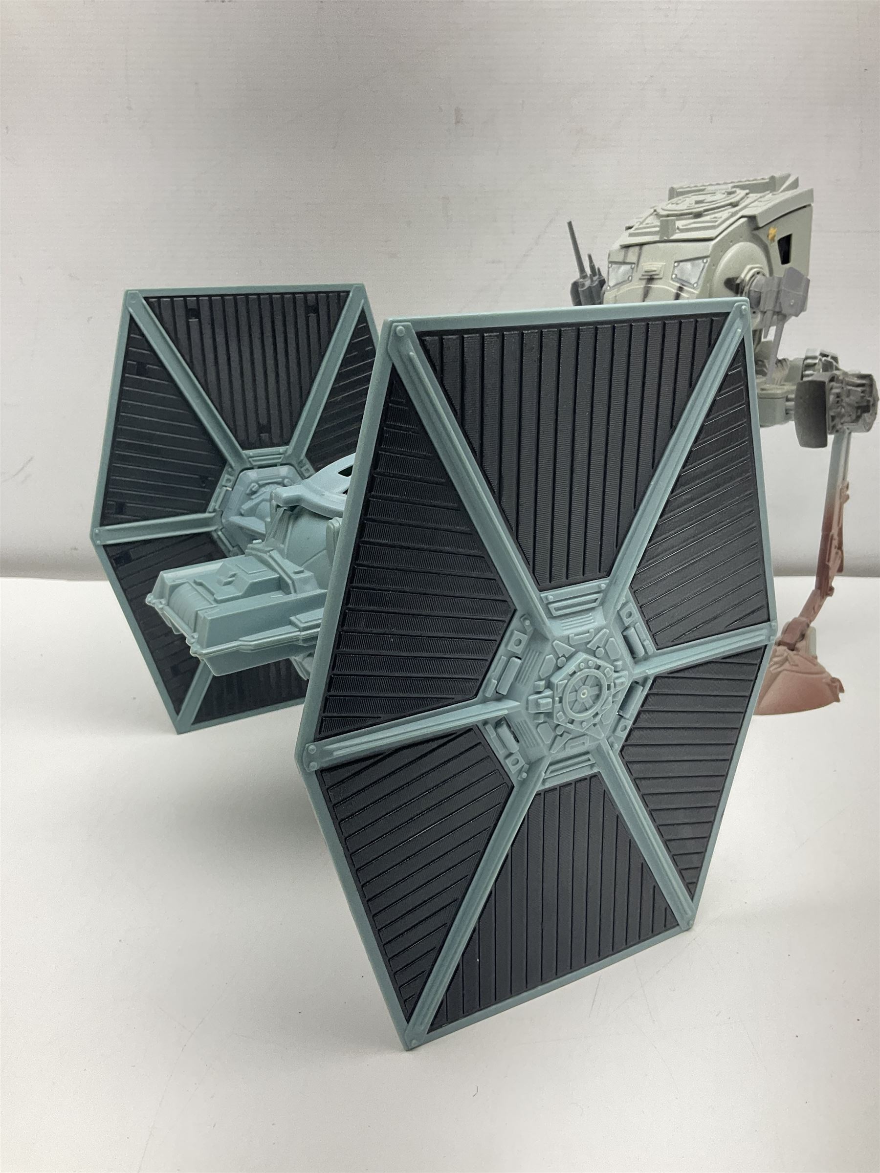 Star Wars - four space/land vehicles comprising Millenium Falcon with hinged top and figures; TIE Fighter; X-Wing Fighter with pilot; and AT-ST 'Chicken Walker' transporter; all unboxed (4)