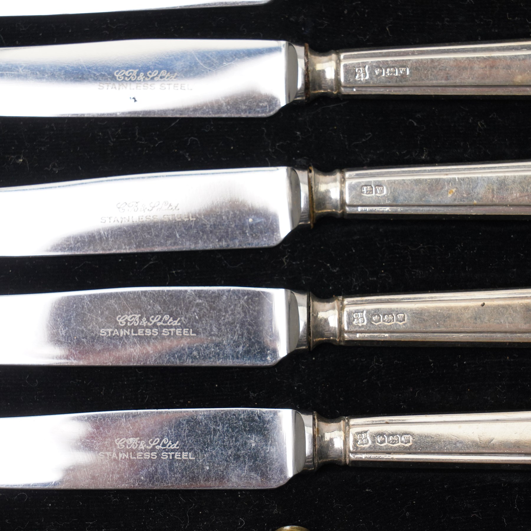 19th century engraved silver buckle 13cm x 9cm, the reverse engraved 1849, unmarked but tests 90 standard, cut glass globe scent flask with silver cover Sheffield 1911 and a cased set of six silver handled tea knives