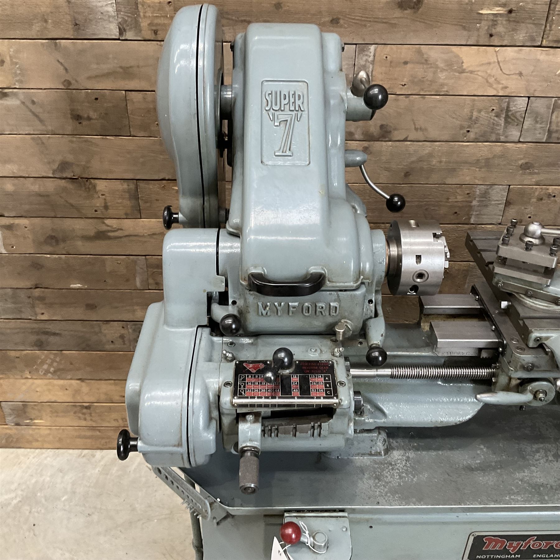 Myford Super 7 metal turning lathe with extensive collection of attachments, chucks, collets, bits; and precision metal saw