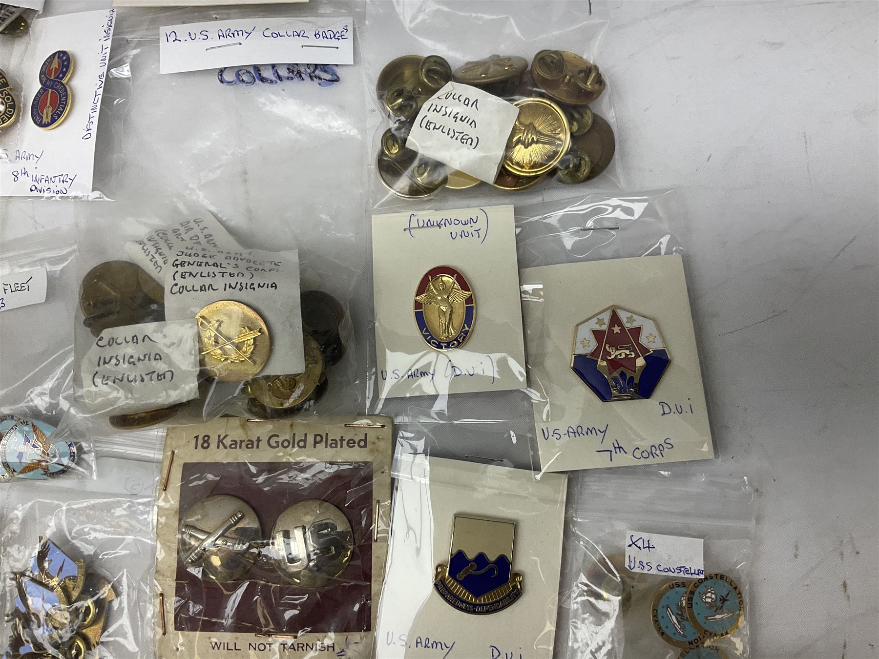 American patches and badges, including para wings, USS Constellation, Strategic Air Command, U.S. military academy, health service regt, Navy Seals, Air Defence Command, Seventh Fleet, various collar badges etc