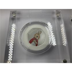 Four The Royal Mint United Kingdom 2018 silver proof fifty pence coins from the 'Celebrating Beatrix Potter and Her Little Tales' collection comprising 'Peter Rabbit', 'The Tailor of Gloucester', 'Flopsy Bunny' and 'Mrs Tittlemouse', all cased with certificates