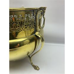 Early 20th century brass coal bucket with pierced sides, upon three pad feet, together with a pair of brass fire dogs, with flambe finials, coal bucket H27cm